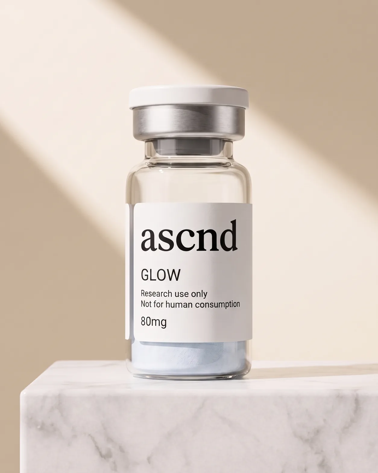 Clear glass ASCND vial of lyophilized powder with a research-use-only label, on a marble plinth