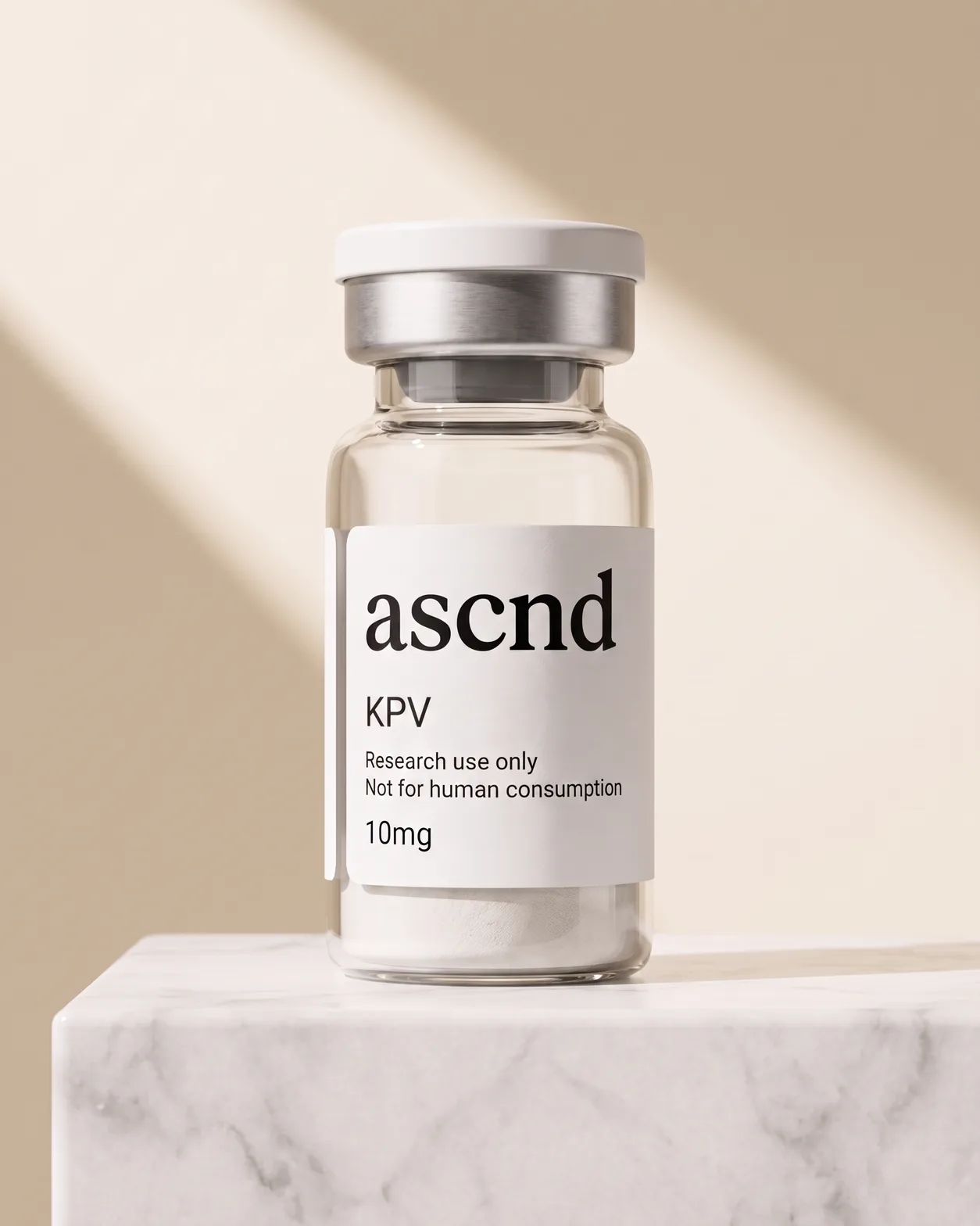 Clear glass ASCND vial of white lyophilized powder with a research-use-only label, on a marble plinth