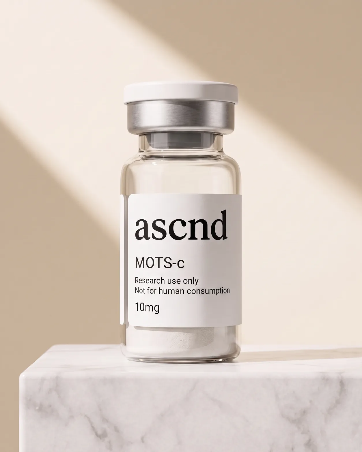 ASCND vial labelled MOTS-c 10mg beside its black ascnd carton, on a studio background